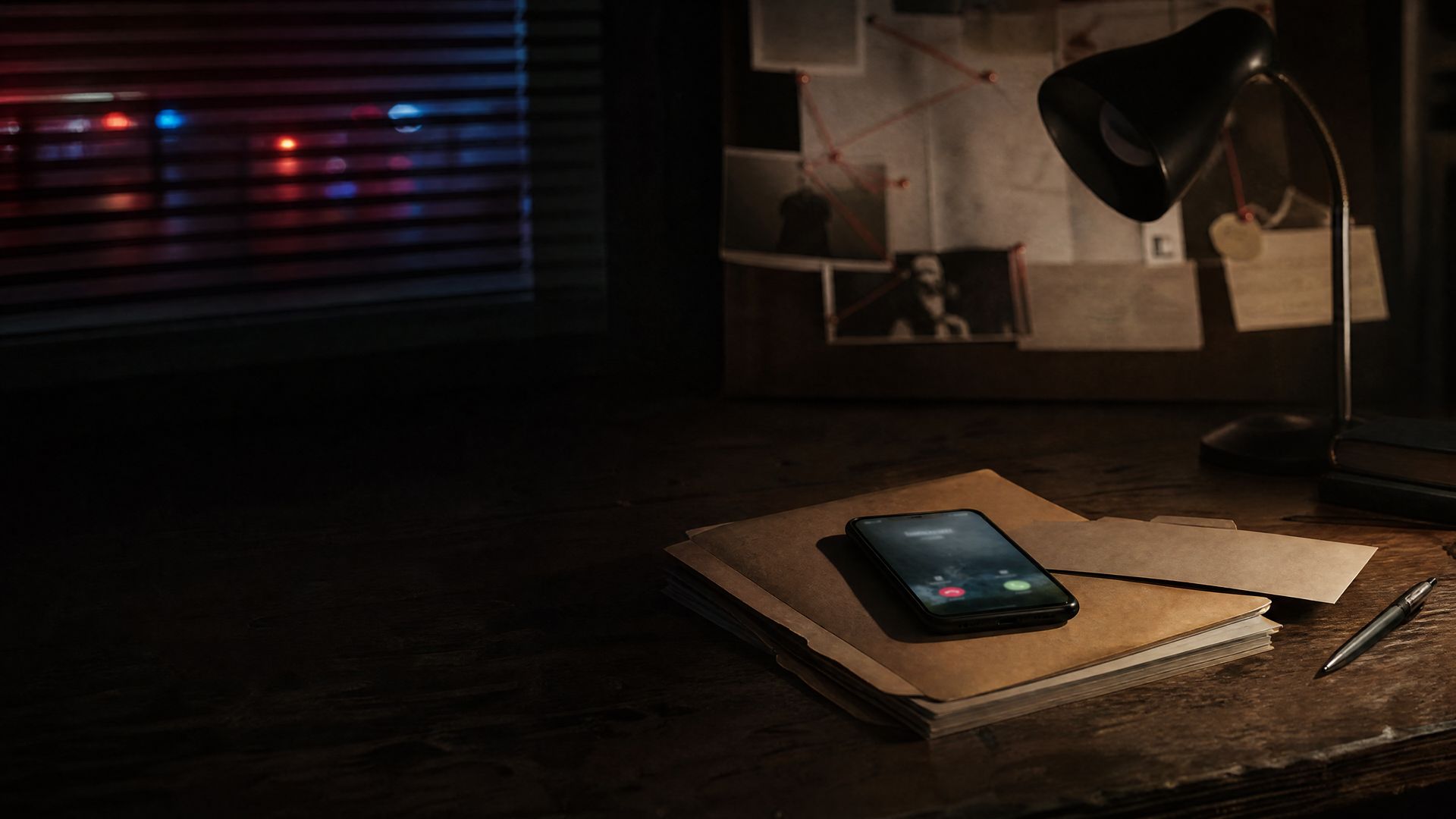 A phone lighting up with an incoming call on a case file, on a dark desk, police lights through the blinds