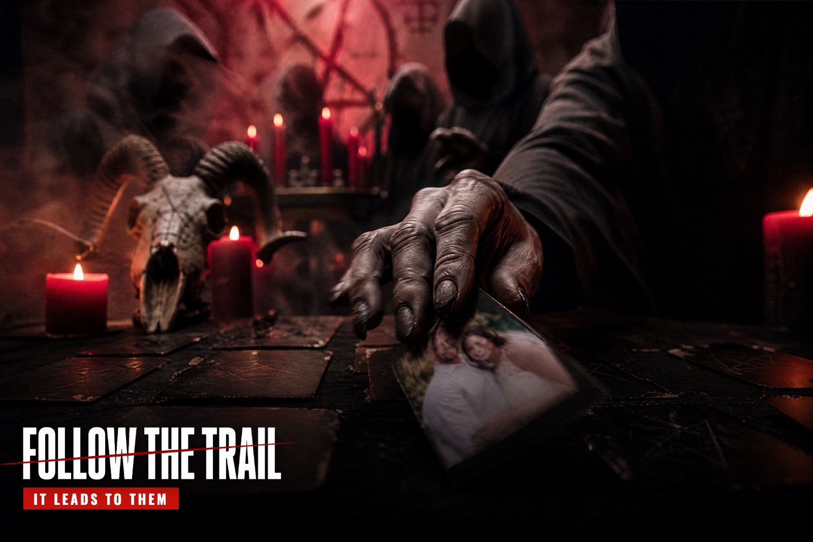 A couple investigates at their kitchen table, a church website on the laptop, while red candles burn on their windowsill and goat-masked cult members stand outside